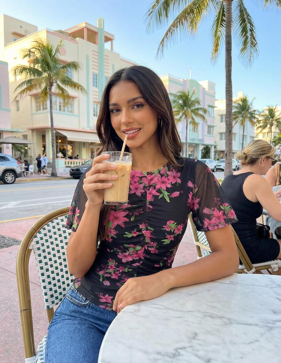 imageMEROKEETY Womens Mesh Floral Tops Summer 2026 Ruched Ruffle Short Sleeve Crew Neck Trendy Going Out BlouseBlack