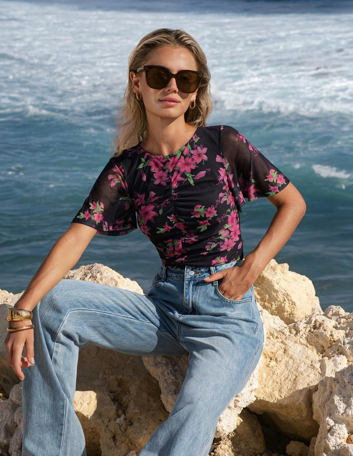 imageMEROKEETY Womens Mesh Floral Tops Summer 2026 Ruched Ruffle Short Sleeve Crew Neck Trendy Going Out BlouseBlack