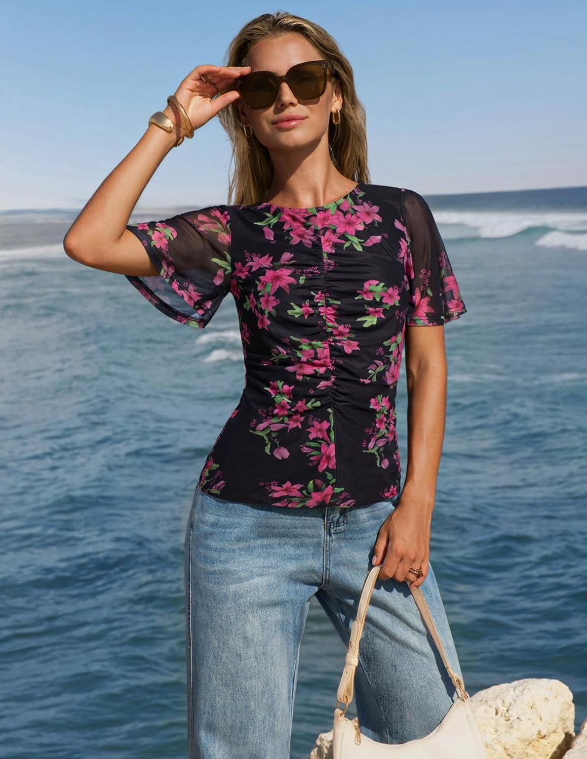 imageMEROKEETY Womens Mesh Floral Tops Summer 2026 Ruched Ruffle Short Sleeve Crew Neck Trendy Going Out BlouseBlack