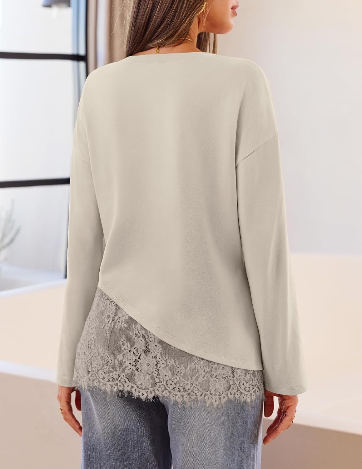 image:imageMEROKEETY Womens Long Sleeve Tops Fall 2026 Lace Patchwork Casual Shirts Elegant Asymmetrical Hem Classic Crew Neck Ribbed Trim Cotton Trendy Fashion Loose Fit Going Out Date Night BlouseSand
