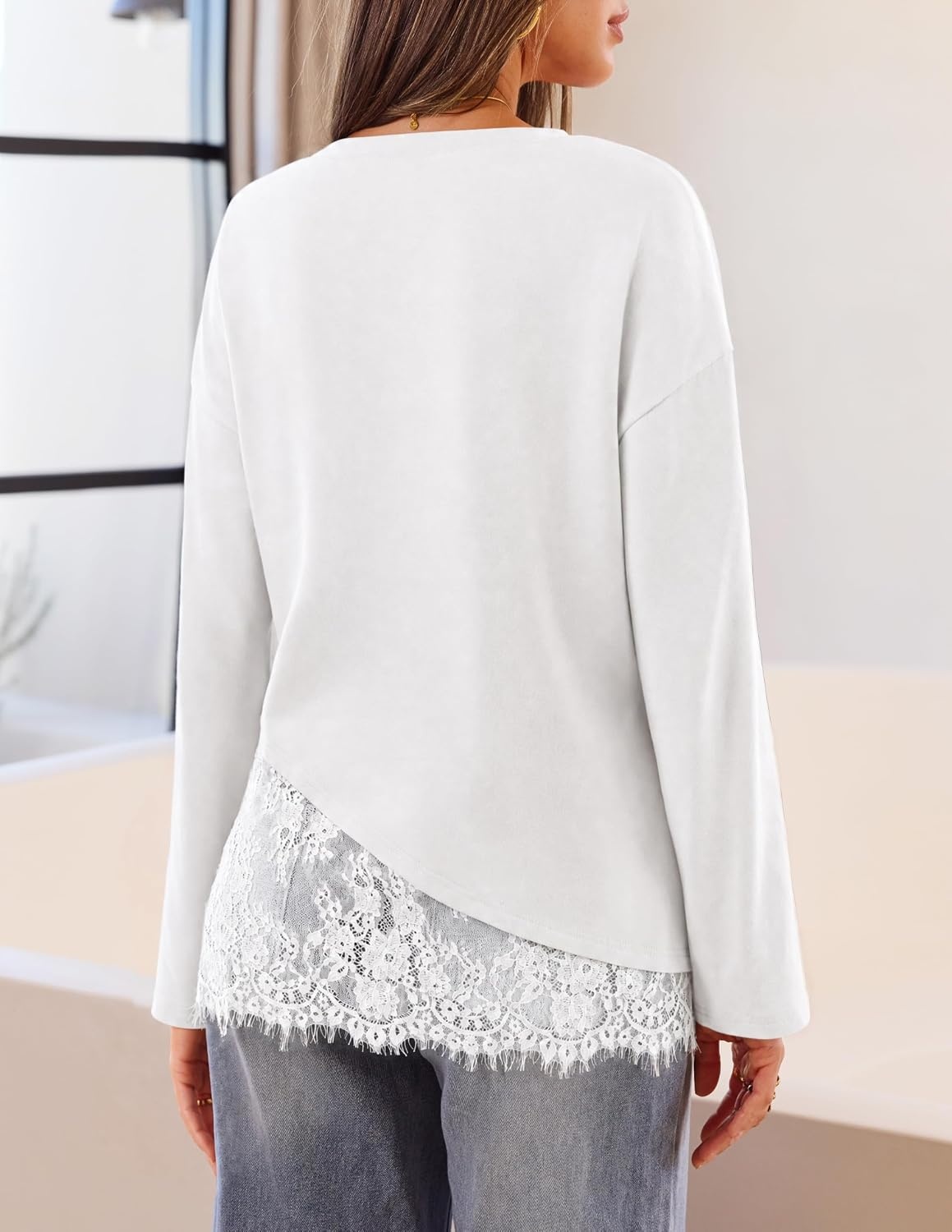image:imageMEROKEETY Womens Long Sleeve Tops Fall 2026 Lace Patchwork Casual Shirts Elegant Asymmetrical Hem Classic Crew Neck Ribbed Trim Cotton Trendy Fashion Loose Fit Going Out Date Night BlouseWhite